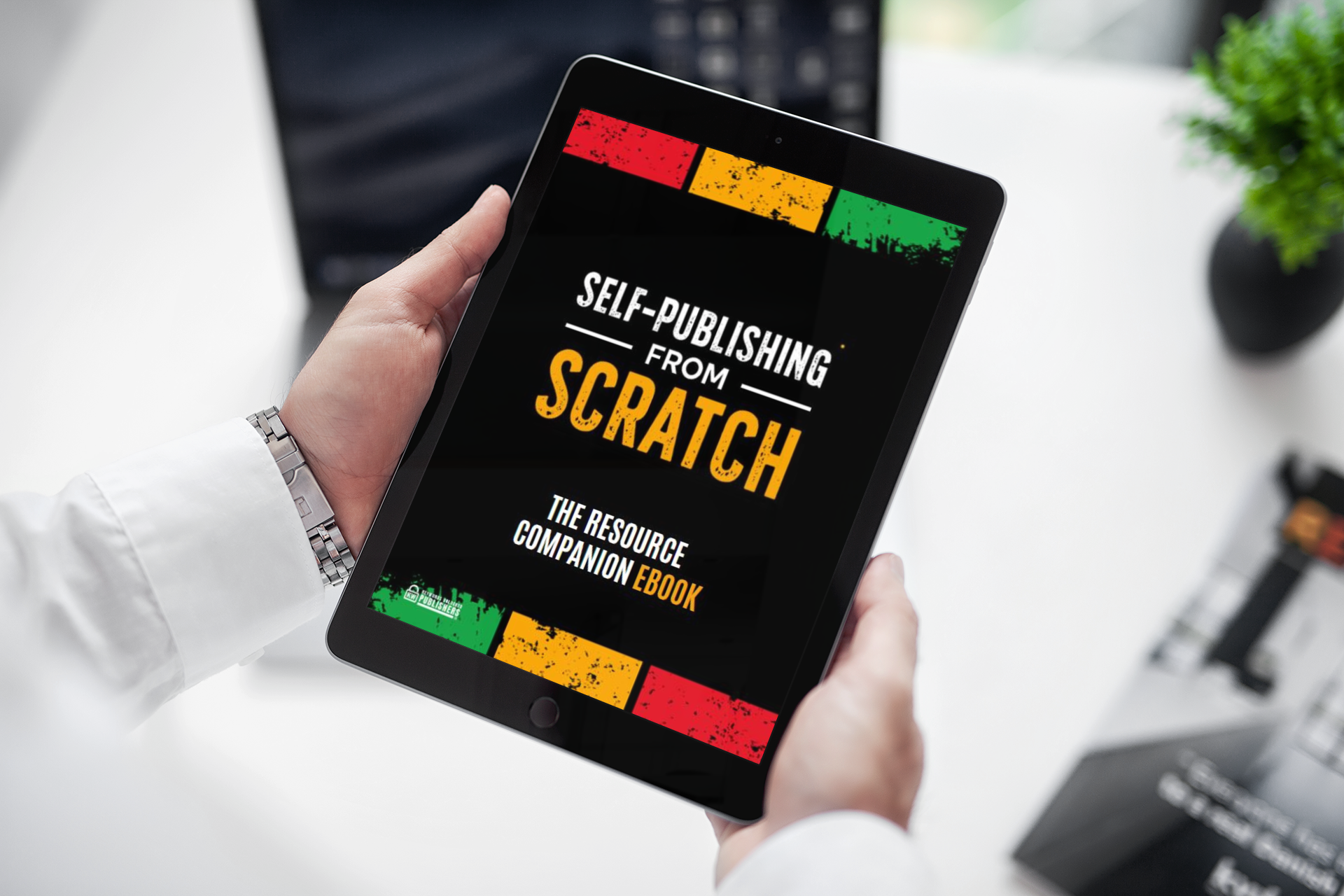 mockup-of-a-man-holding-an-ipad-mini-at-work-2106-el1